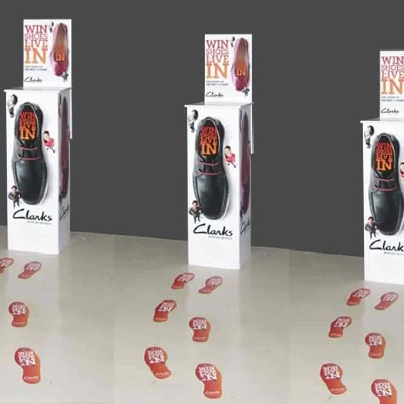 Free-standing entry boxes with footprint decals on floor - Displays2Go