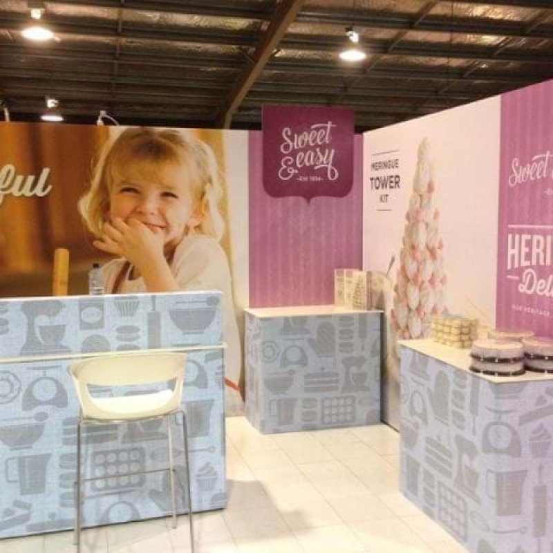 Expo banners mounted directly to the booth wall - Displays2Go