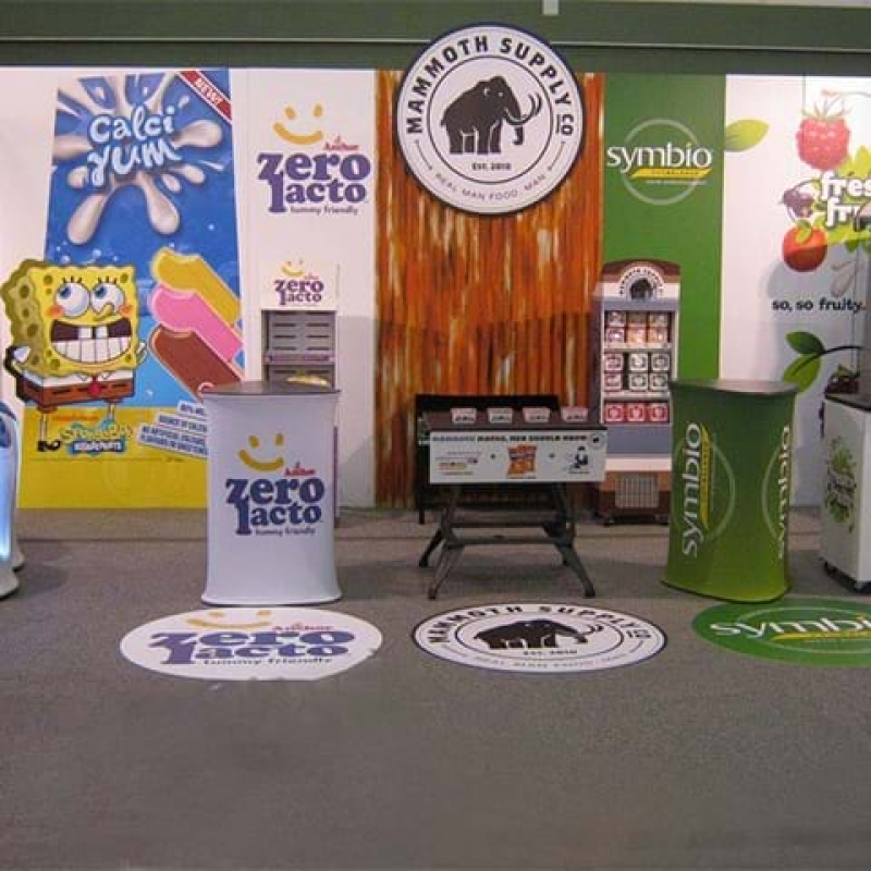 Folding laminated panels mounted to a booth wall - Displays2Go