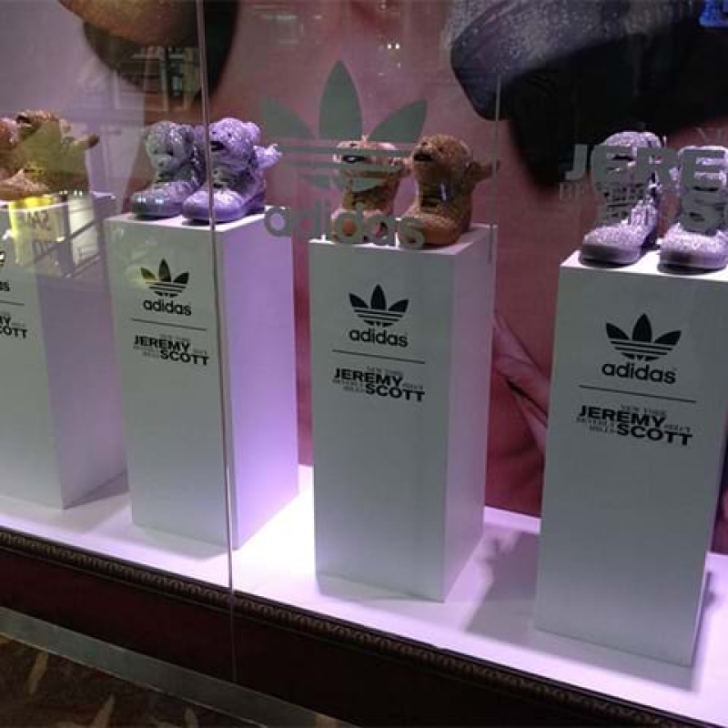 Acrylic display box on top of a plinth - Displays2Go