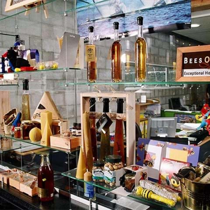 Glass display shelves supported by wires - Displays2Go
