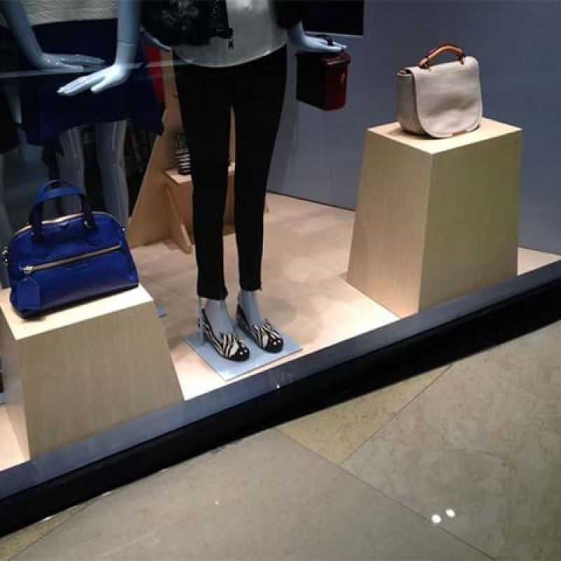 Display pedestal in shop window display - Displays2Go