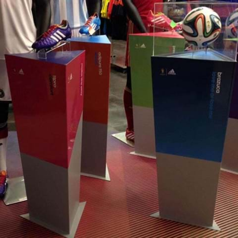 Customised triangular stands for sports store display - Displays2Go