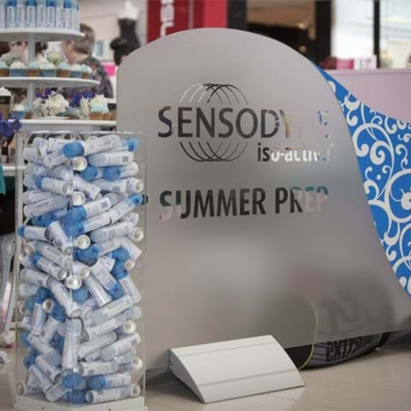 Clear acrylic plinth being used as dump bin - Displays2Go